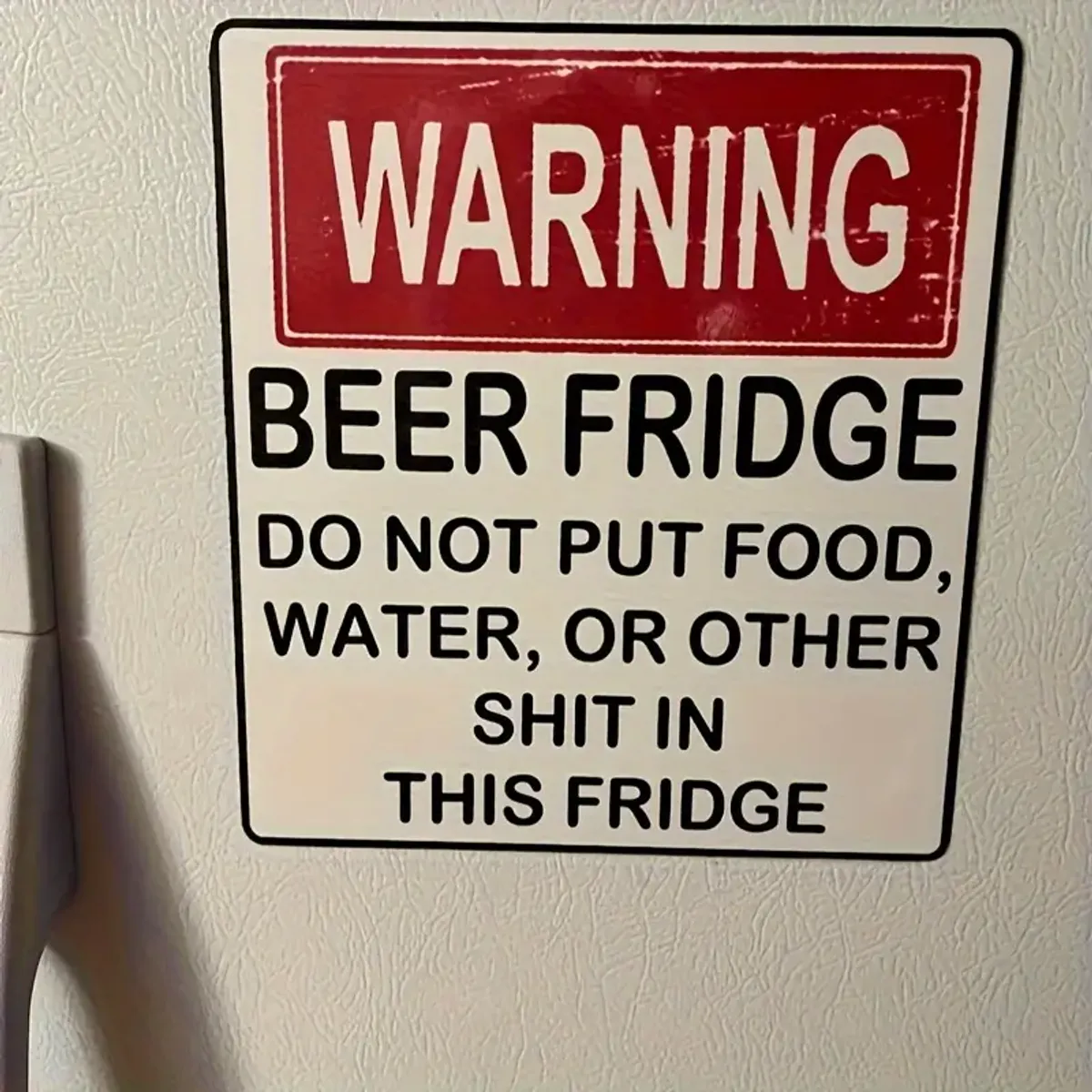 Kjøleskapsmagnet, Warning